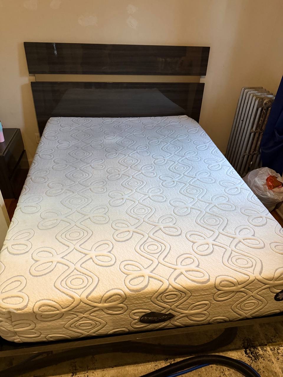Same patterned mattress with the large visible stain reduced after Stain Steamer cleaning