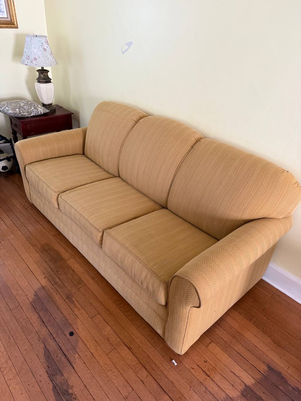 Same tan sofa with cleaner-looking cushions and back after Stain Steamer cleaning