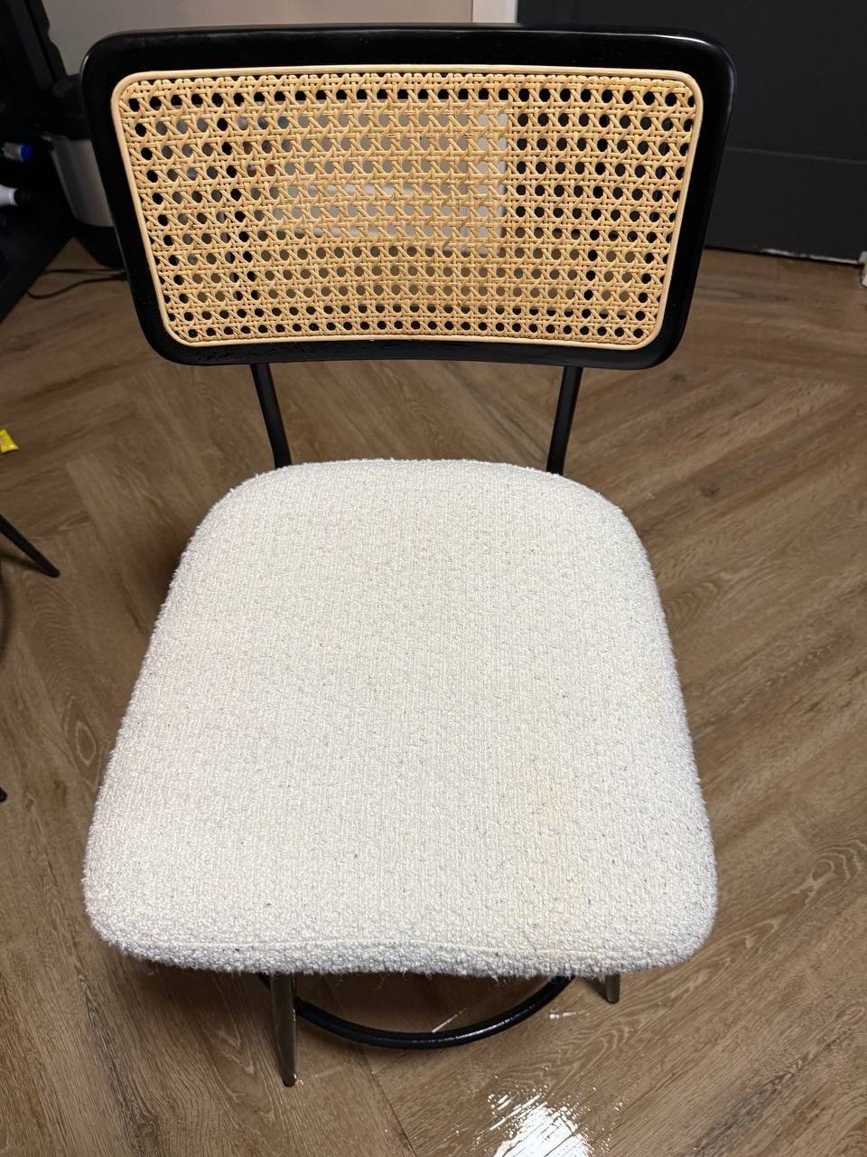 Light upholstered dining chair with a stained seat before cleaning