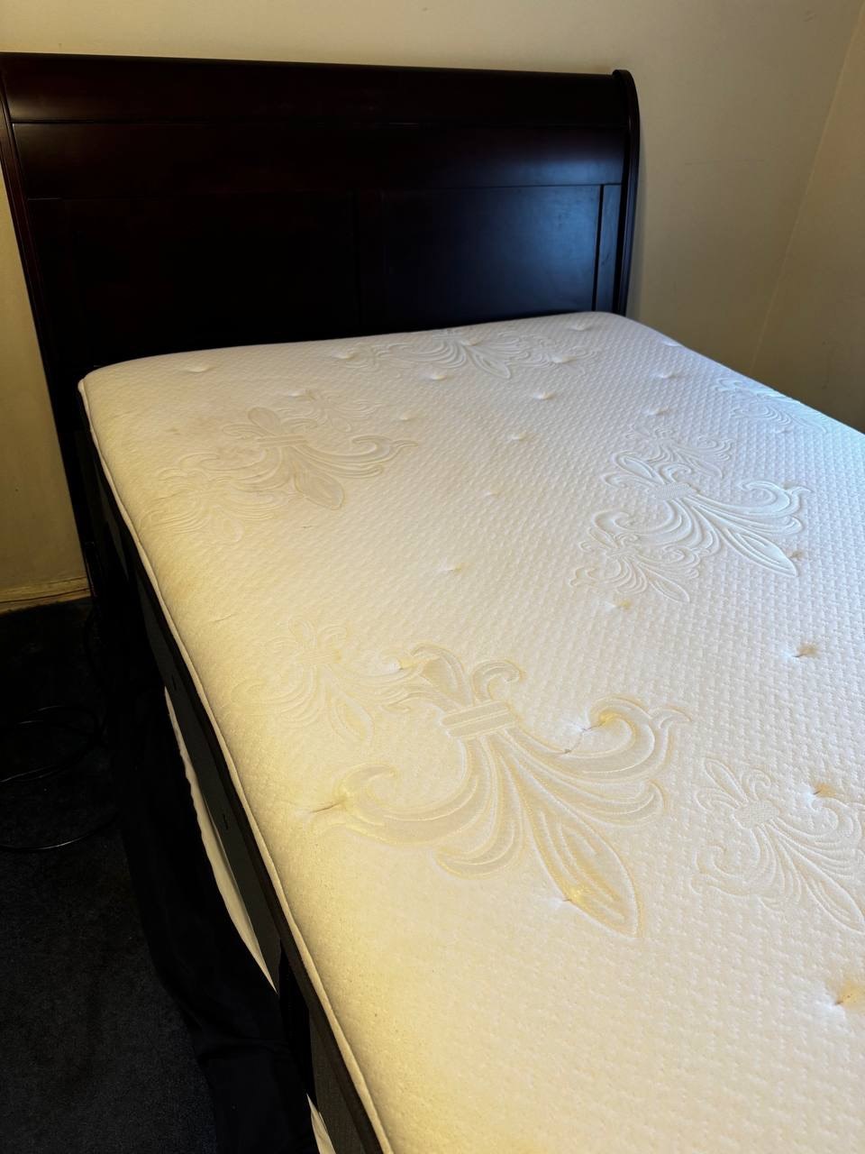 White mattress with yellowish stains before cleaning