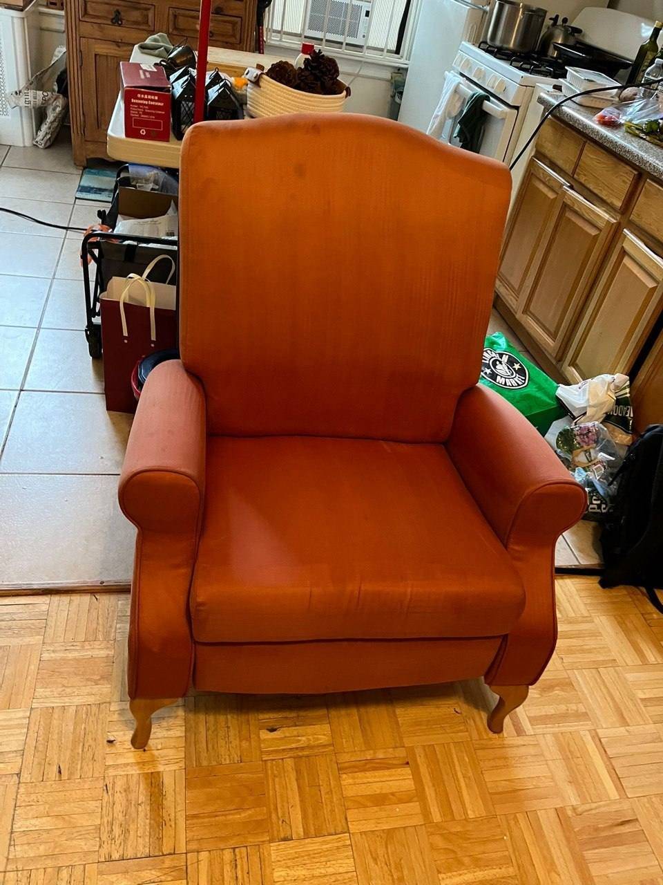 Same orange microfiber recliner soft and evenly colored after Stain Steamer cleaning