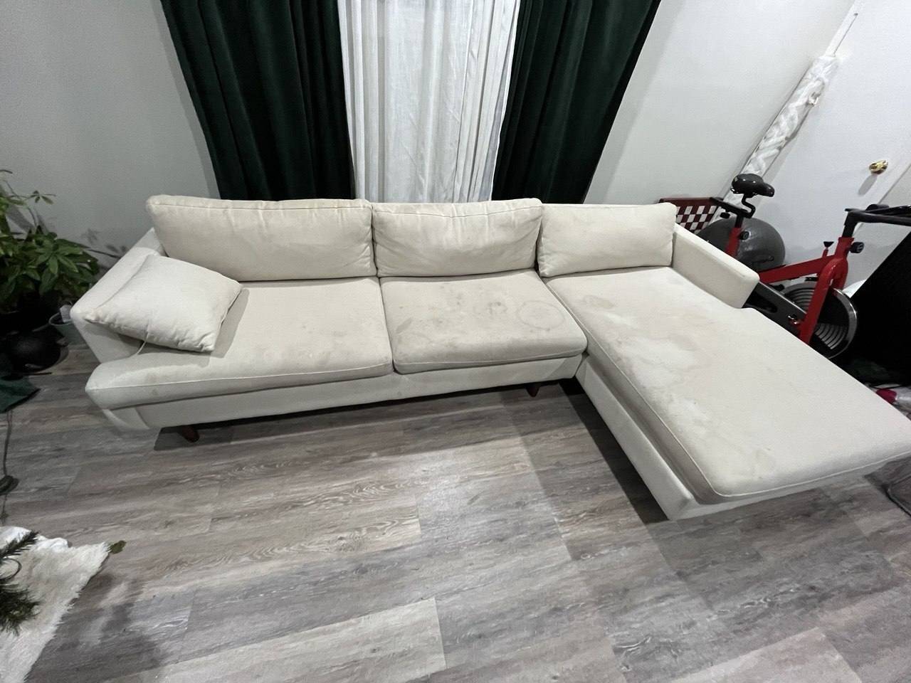 Cream sectional sofa with rings and body soil before sectional couch cleaning
